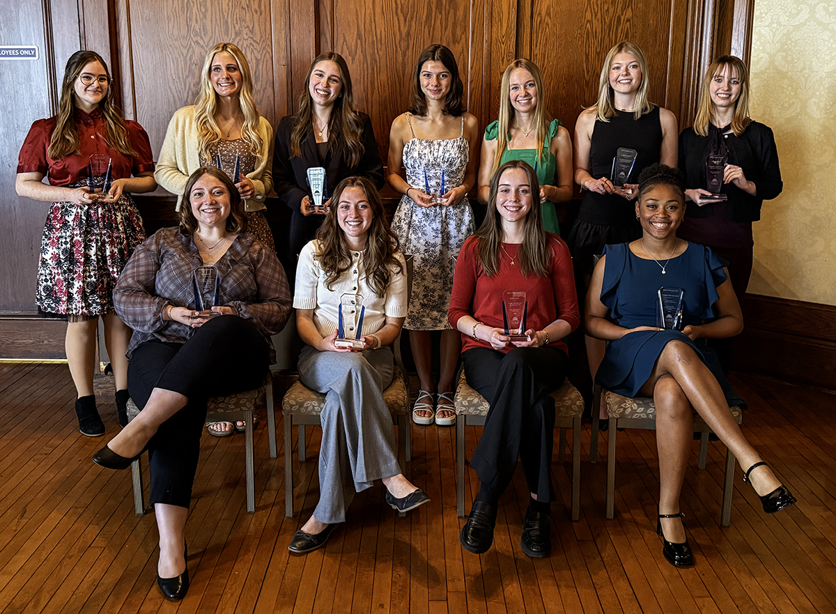 Group photo of the 2026 Akron Press Club scholarship recipients holding their awards during the organization's annual scholarship luncheon.