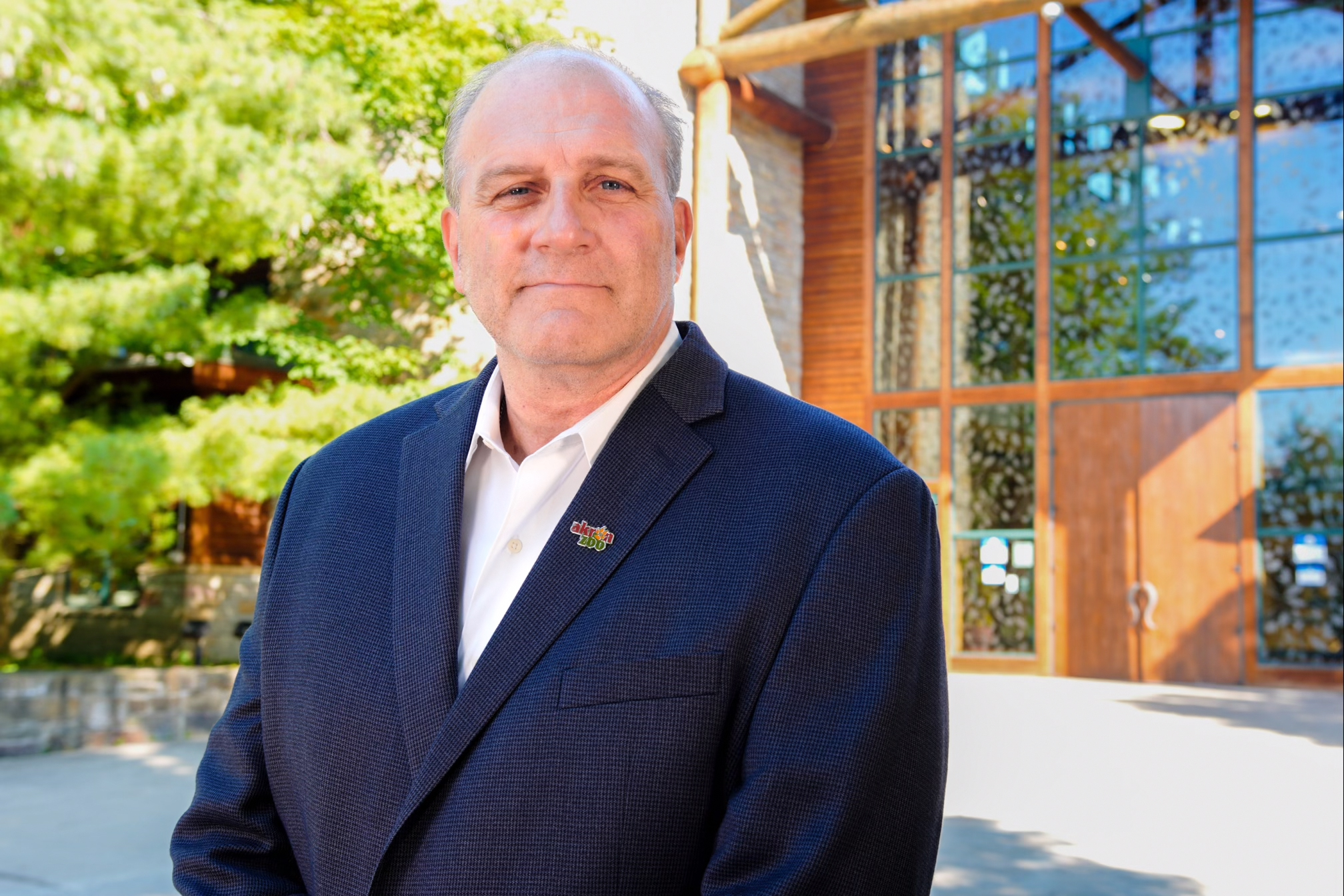 caucasian man in navy suite jacket and white dress shirt