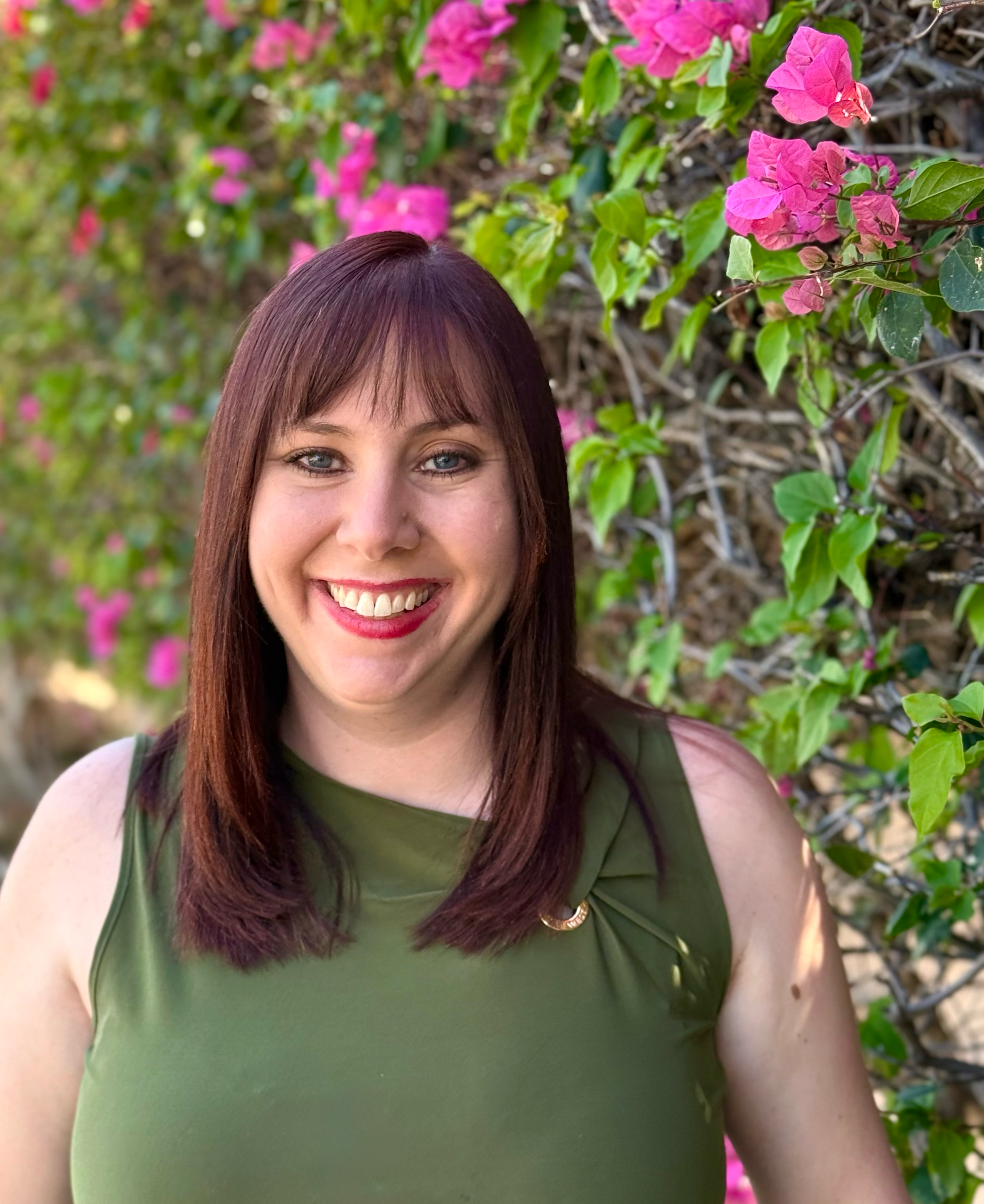 woman with medium length brown hair smiling 