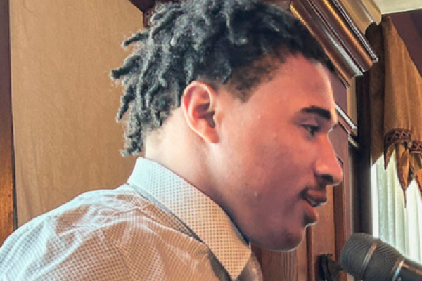 high school student speaking at podium