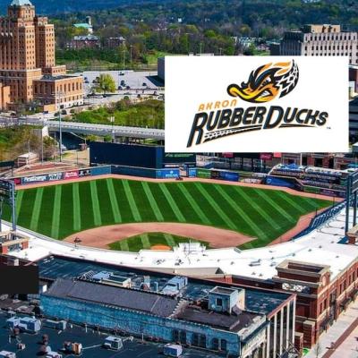 Aerial view of 7 17 Credit Union Park in downtown Akron with the Akron RubberDucks logo overlaid above the baseball field.
