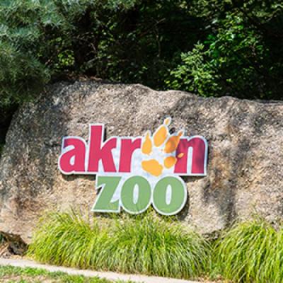 Large rock with an Akron Zoo logo 